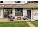 Charming back patio includes an outdoor seating area, a lush lawn and access to home at 3930 S Hillcrest Dr, Denver, CO 80237