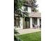 Back of house and patio view with outdoor seating at 3930 S Hillcrest Dr, Denver, CO 80237