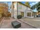 Well-maintained backyard featuring a patio, beautiful plantings and lawn area at 3930 S Hillcrest Dr, Denver, CO 80237
