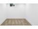Unfurnished basement with new carpet, neutral paint, and a single window at 3930 S Hillcrest Dr, Denver, CO 80237