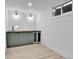 Finished basement with a wet bar area at 3930 S Hillcrest Dr, Denver, CO 80237
