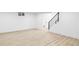 Finished basement with modern flooring and freshly painted walls at 3930 S Hillcrest Dr, Denver, CO 80237
