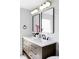 Bathroom vanity with double sinks, modern fixtures, and ample counter space at 3930 S Hillcrest Dr, Denver, CO 80237