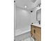 Modern bathroom features sleek white subway tiles, a bathtub, and a contemporary vanity with stylish fixtures at 3930 S Hillcrest Dr, Denver, CO 80237