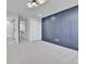 Carpeted bedroom featuring a modern color scheme and an attached bathroom at 3930 S Hillcrest Dr, Denver, CO 80237