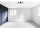 Bright, spacious bedroom with modern lighting and wainscoting, offering comfort and style at 3930 S Hillcrest Dr, Denver, CO 80237