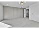 Carpeted bedroom with modern lighting and ample space at 3930 S Hillcrest Dr, Denver, CO 80237