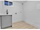 Laundry room features a utility sink and plenty of space for washer and dryer hookups at 3930 S Hillcrest Dr, Denver, CO 80237