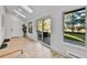 Sunlit living area with modern decor and view to the backyard at 3930 S Hillcrest Dr, Denver, CO 80237