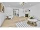 Bright living room features hardwood floors, fireplace, and neutral decor at 3930 S Hillcrest Dr, Denver, CO 80237