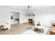 Cozy living room showcasing hardwood floors, a fireplace, and comfortable seating at 3930 S Hillcrest Dr, Denver, CO 80237