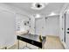 Well-lit office area with a sleek desk and hardwood floors at 3930 S Hillcrest Dr, Denver, CO 80237