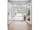 Sun room with access to outdoor patio, features hardwood floors, glass doors and plenty of natural light at 3930 S Hillcrest Dr, Denver, CO 80237