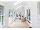Bright sunroom with skylights, hardwood floors, and floor to ceiling windows at 3930 S Hillcrest Dr, Denver, CO 80237
