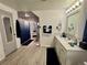 Bathroom featuring vanity, shower with blue-ombre curtain, and blue accessories at 22400 County Road 10, Hudson, CO 80642