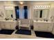 Bright bathroom with double vanity sinks and modern fixtures at 22400 County Road 10, Hudson, CO 80642