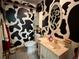 Whimsical bathroom featuring unique black and white cow print decor at 22400 County Road 10, Hudson, CO 80642