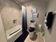 Well-lit bathroom with a shower-tub combo and coordinated decor at 22400 County Road 10, Hudson, CO 80642