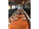 Elegant dining room setup with a long table and seating for a large group at 22400 County Road 10, Hudson, CO 80642