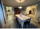Dining room view into kitchen; features modern decor and hardwood floors at 22400 County Road 10, Hudson, CO 80642