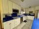 Modern kitchen with custom cabinets, stainless steel appliances, and stylish countertops at 22400 County Road 10, Hudson, CO 80642