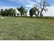 Sprawling green field with mature trees, perfect for recreation or development at 22400 County Road 10, Hudson, CO 80642
