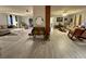 Spacious living room featuring hardwood floors and neutral-toned furniture at 22400 County Road 10, Hudson, CO 80642