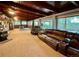 Spacious living room featuring hardwood floors, stone accents, and comfortable seating at 22400 County Road 10, Hudson, CO 80642