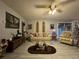 Relaxing living room features a comfortable sofa, unique decor, and ample natural light at 22400 County Road 10, Hudson, CO 80642