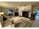 Living room with a fireplace, neutral furnishings, and access to a dining area at 22400 County Road 10, Hudson, CO 80642