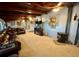 Cozy living room featuring a stone fireplace and rustic decor at 22400 County Road 10, Hudson, CO 80642