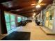 Open living room with natural light, stone accents, and access to the backyard at 22400 County Road 10, Hudson, CO 80642