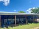 Image of an open-air outbuilding sheltering an ATV, truck, and other equipment, providing functional storage solutions at 22400 County Road 10, Hudson, CO 80642