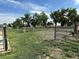 Fenced pasture with mature trees on property, offering space for livestock or outdoor activities at 22400 County Road 10, Hudson, CO 80642