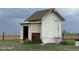 Rustic shed with weathered wood and a functional design, ideal for storage on an expansive lot at 22400 County Road 10, Hudson, CO 80642