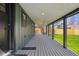 Long back porch with outdoor access to backyard with wooden fence at 3680 S Logan St, Englewood, CO 80113