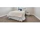 Bedroom featuring white bedding, a white pouf and neutral carpeting at 3680 S Logan St, Englewood, CO 80113