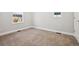 Neutral bedroom with carpet, white trim and ample natural light from window at 3680 S Logan St, Englewood, CO 80113