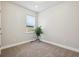 Bright bedroom with neutral carpet, white trim and ample natural light from the window at 3680 S Logan St, Englewood, CO 80113