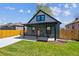 Charming home with a covered porch, well-maintained lawn, and a newly paved driveway at 3680 S Logan St, Englewood, CO 80113
