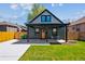Charming home with inviting front porch, manicured lawn, and modern exterior, offering great curb appeal at 3680 S Logan St, Englewood, CO 80113