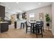 Modern kitchen and dining area with sleek cabinets and stainless steel appliances at 3680 S Logan St, Englewood, CO 80113