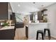 Open kitchen featuring modern cabinetry, countertops, and stainless steel appliances at 3680 S Logan St, Englewood, CO 80113