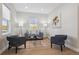 Cozy living room features hardwood floors, modern decor, and ample natural light at 3680 S Logan St, Englewood, CO 80113