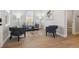 Bright living room featuring modern decor, hardwood floors, and a cozy seating arrangement at 3680 S Logan St, Englewood, CO 80113