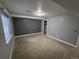 Bedroom with neutral walls, carpet floors, closet with shelving, and large window with lots of light at 1927 Rannoch Dr, Longmont, CO 80504