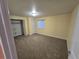 Bedroom featuring carpeted floors, a closet with shelving, and natural light from the window at 1927 Rannoch Dr, Longmont, CO 80504