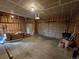 Spacious garage with exposed framing, concrete flooring, and two garage doors at 1927 Rannoch Dr, Longmont, CO 80504
