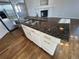 Close up of the kitchen island with granite countertops and stainless steel sink at 1927 Rannoch Dr, Longmont, CO 80504