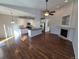Open floor plan featuring a modern kitchen, living room with a fireplace and hardwood floors at 1927 Rannoch Dr, Longmont, CO 80504